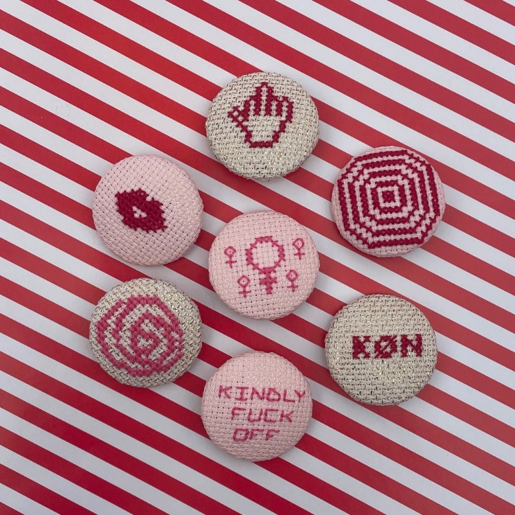 broderede feministiske symboler